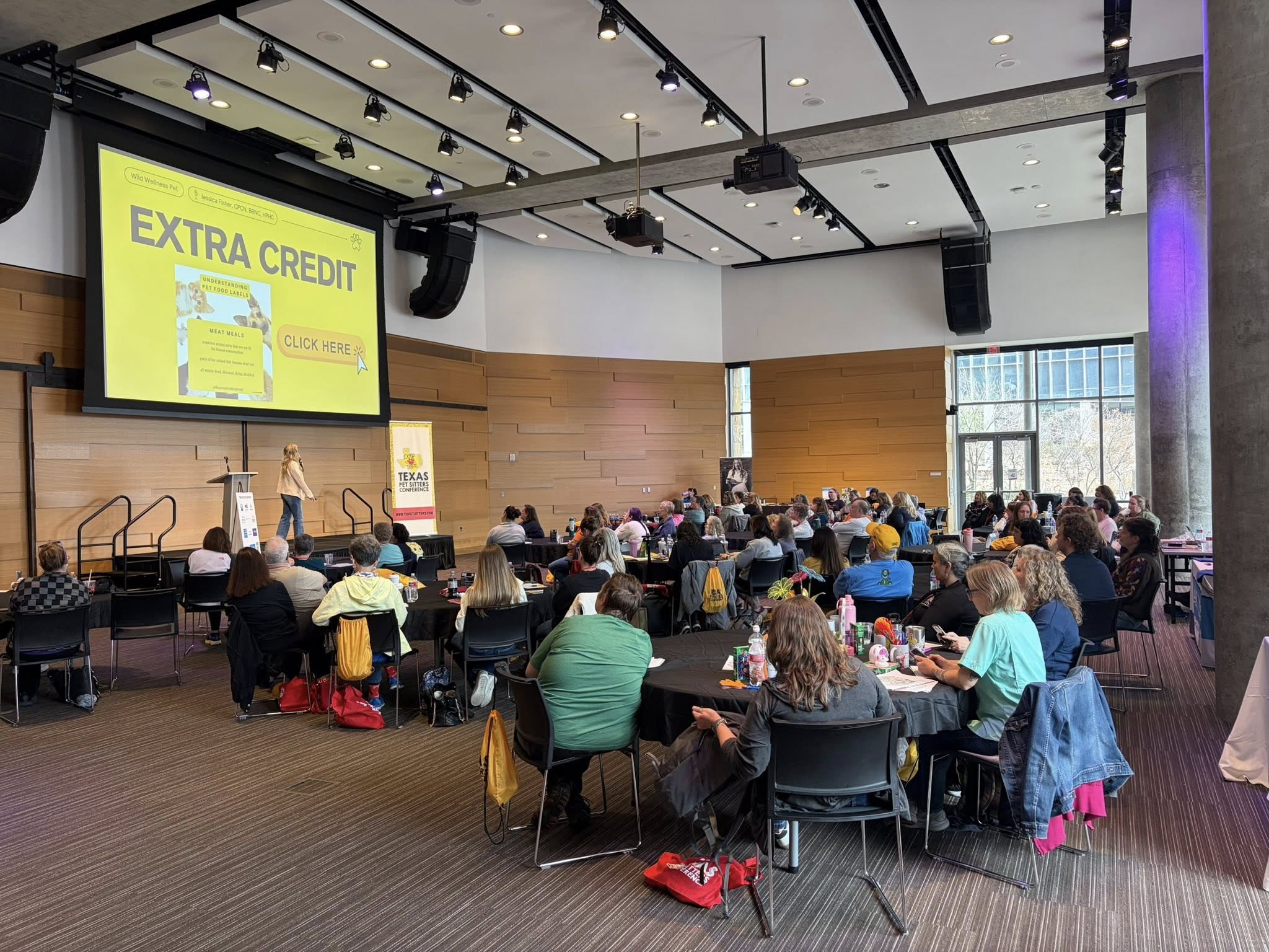 Conference session with attendees at round tables